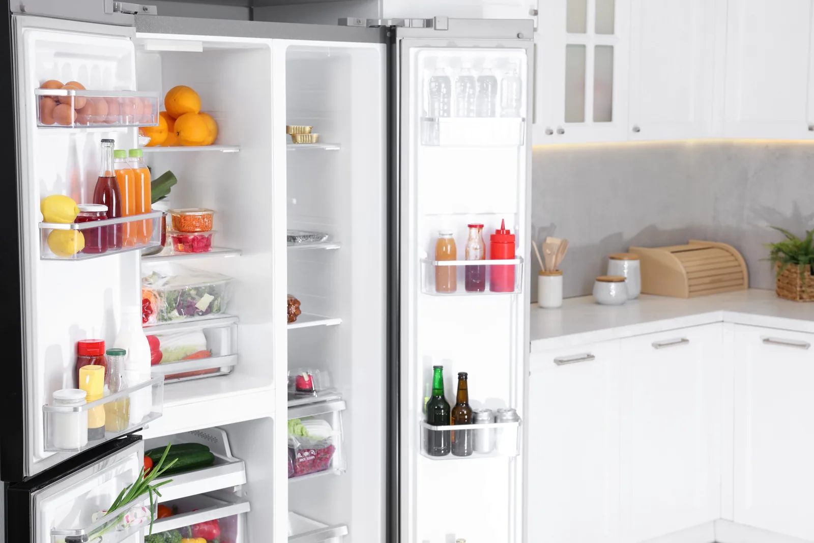 Fridge doors open with drinks and food properly chilled after a regas
